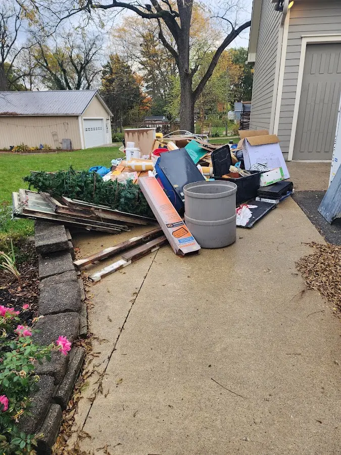 Dumpster being loaded with debris for Estate Cleanout Dumpster Rental in Marlborough